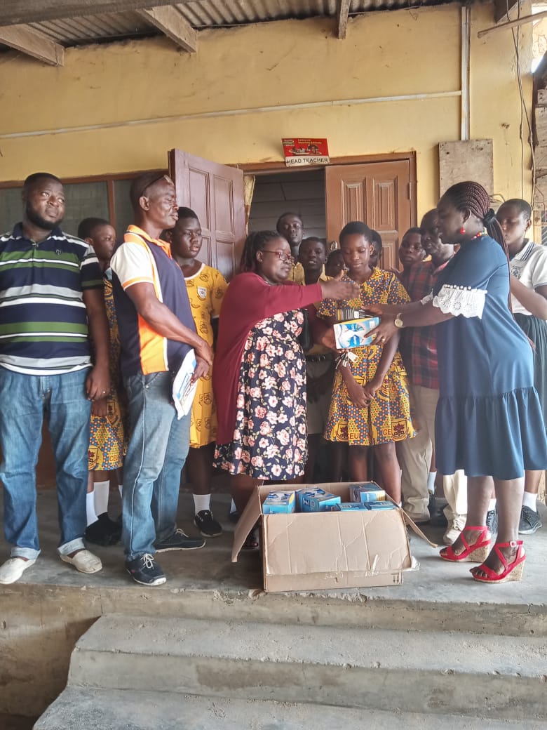 Liberation community impact — distributing care packages in Ghanaian school